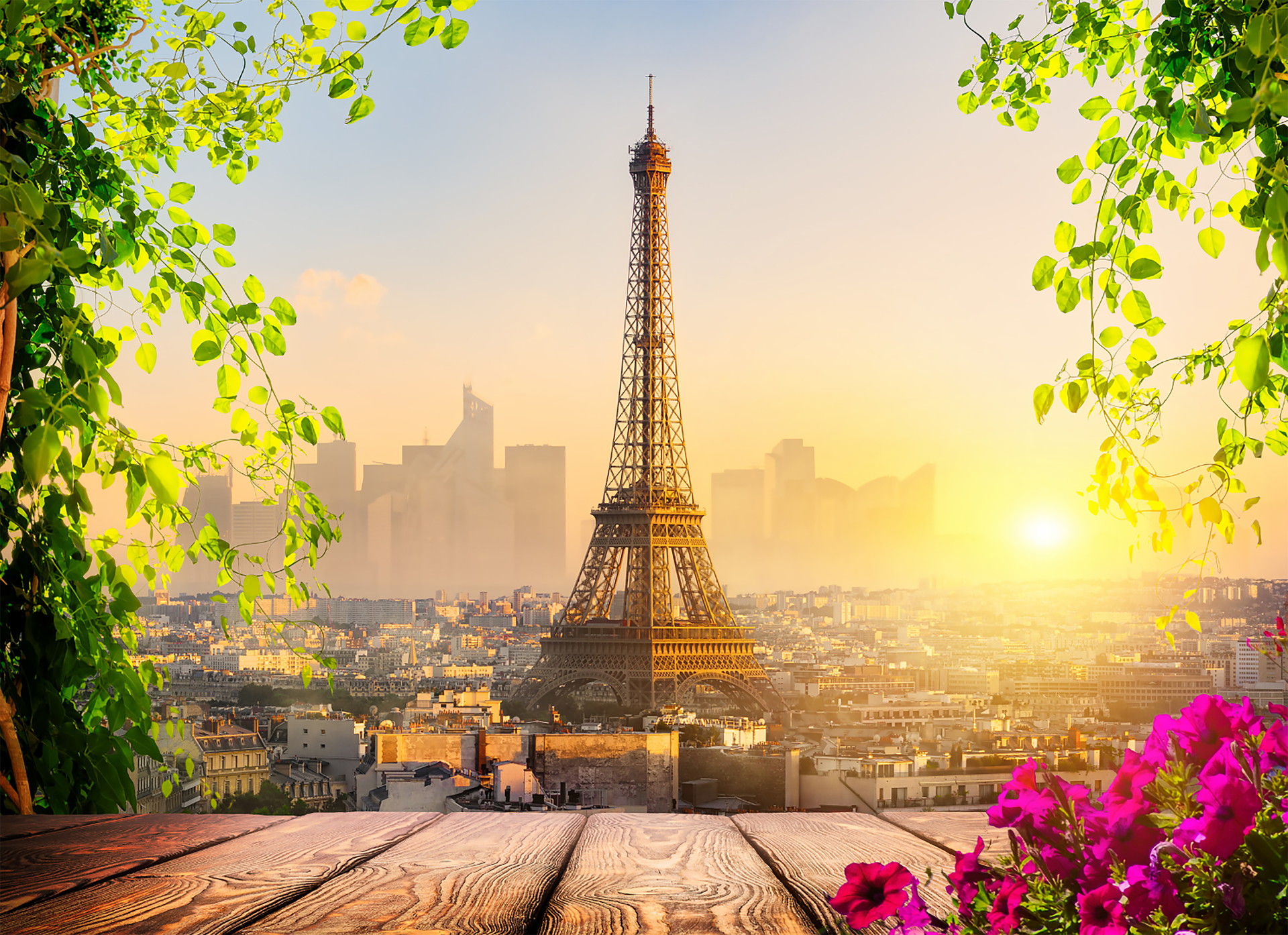 The Eiffel Tower rising over Paris at dusk